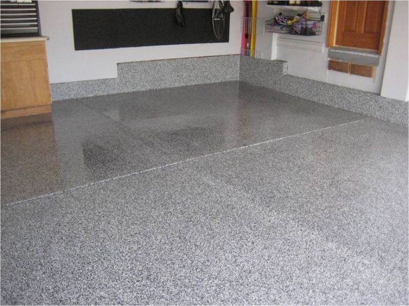 Flake epoxy garage floor with storage cabinets